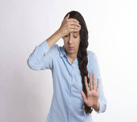 Woman with sinus pressure headache