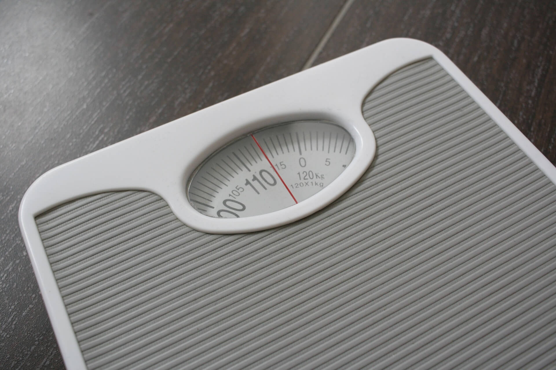 Photograph of a set of scales people use to weigh themselves.