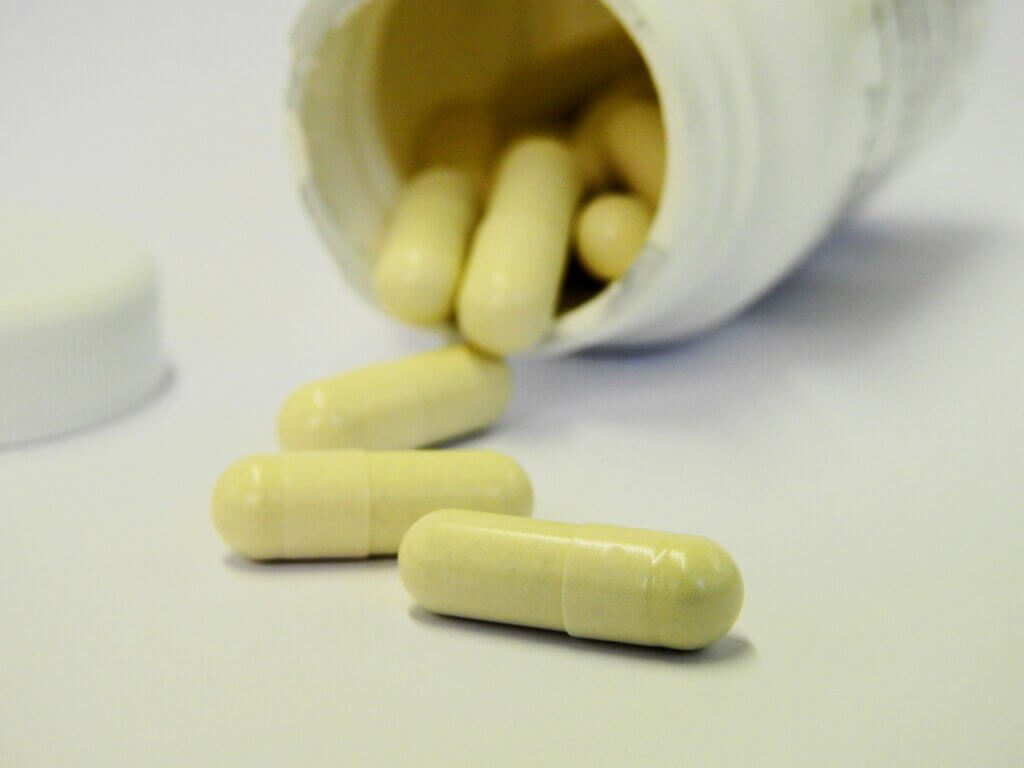 Vitamin B12 supplements on a white surface