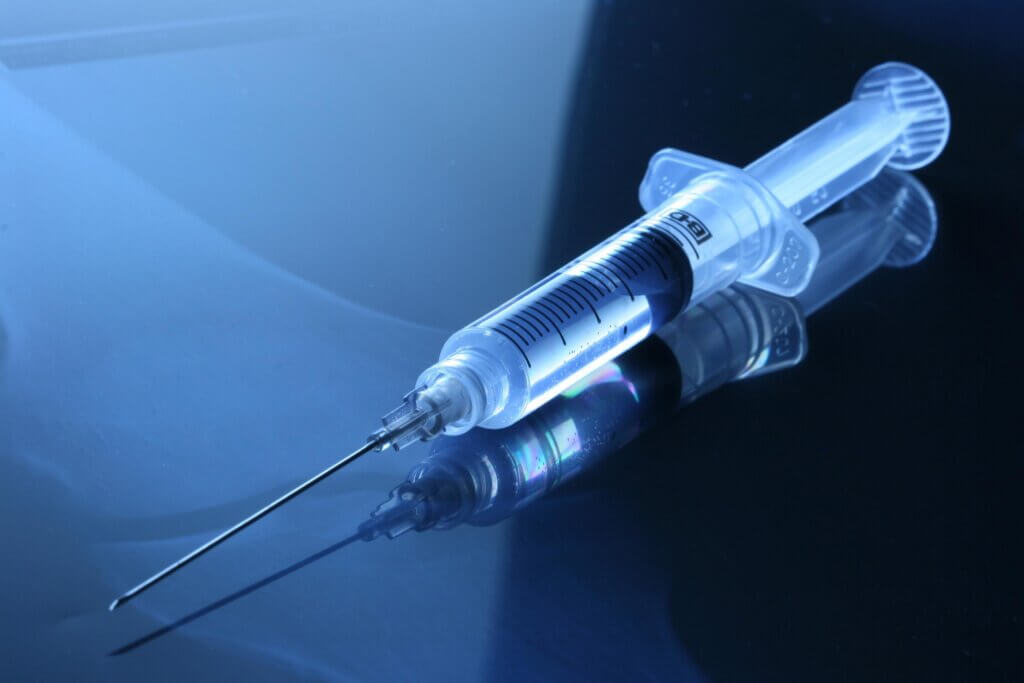 Medical, Syringe, Vaccination on a blue surface